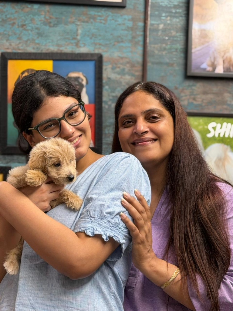 Happy customers with their new puppies