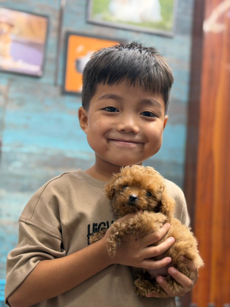 Happy customers with their new puppies