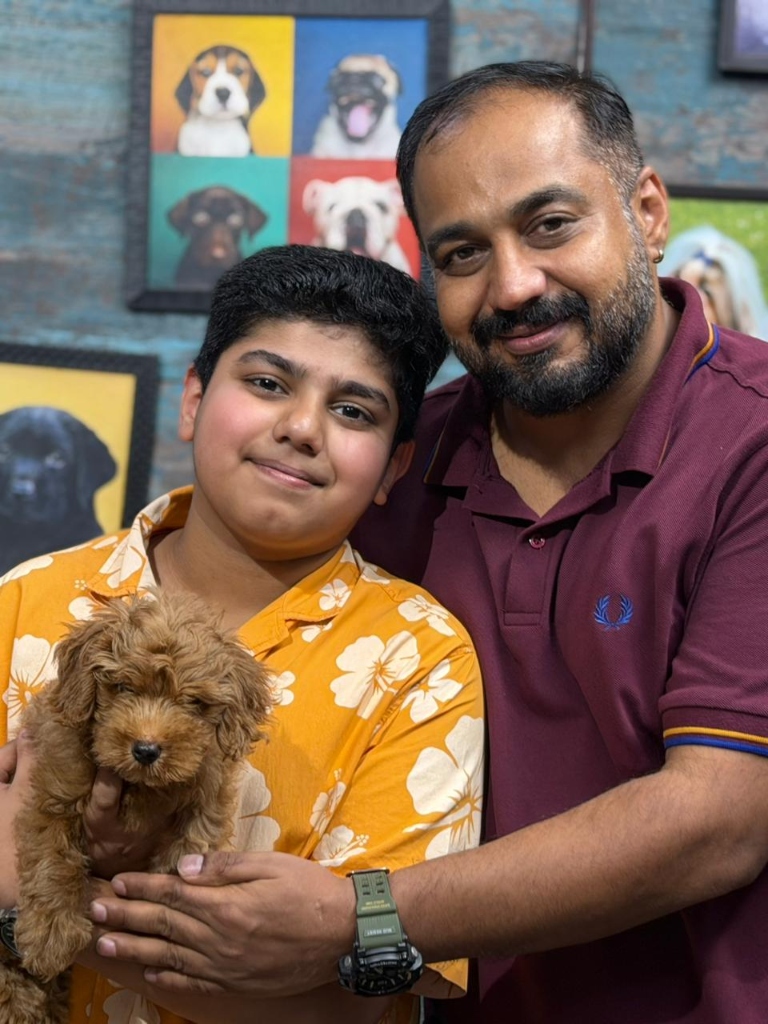 Happy customers with their new puppies